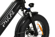 Close-up of PIXAR Ride1 electric bike front fork and tire, showcasing design and sturdiness.