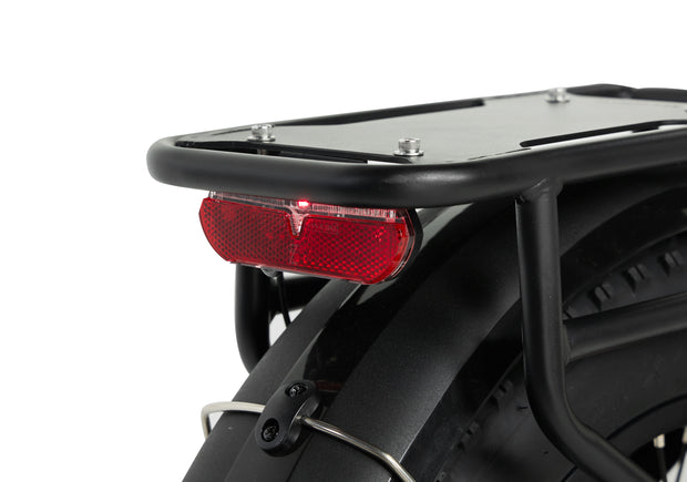 Rear light and rack of the PIXAR Ride1 electric bike, designed for visibility and safety during rides.