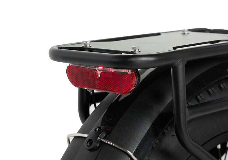 Rear light and rack of the PIXAR Ride1 electric bike, designed for visibility and safety during rides.