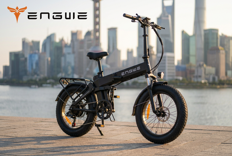 ENGWE Engine Pro 3.0 Boost folding fat-tyre e-bike on a riverside promenade at golden hour