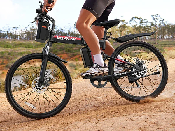 VARUN M26-3 Pro Red being ridden on a dirt path