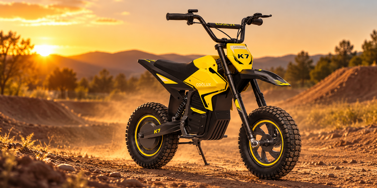 Yellow KOOLUX K7 kids electric dirt bike on a dusty track at sunset